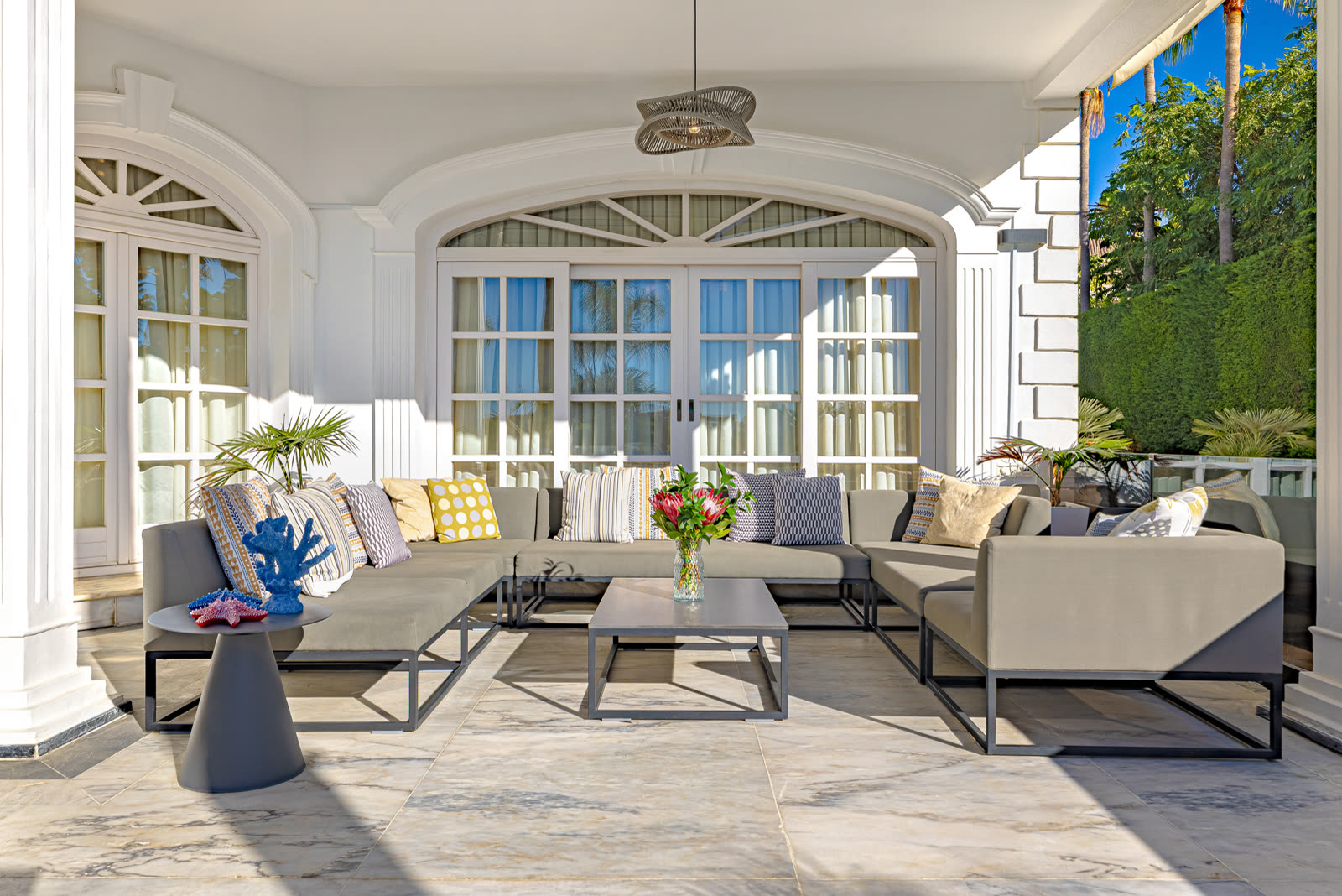 The covered terrace lounge of the villa